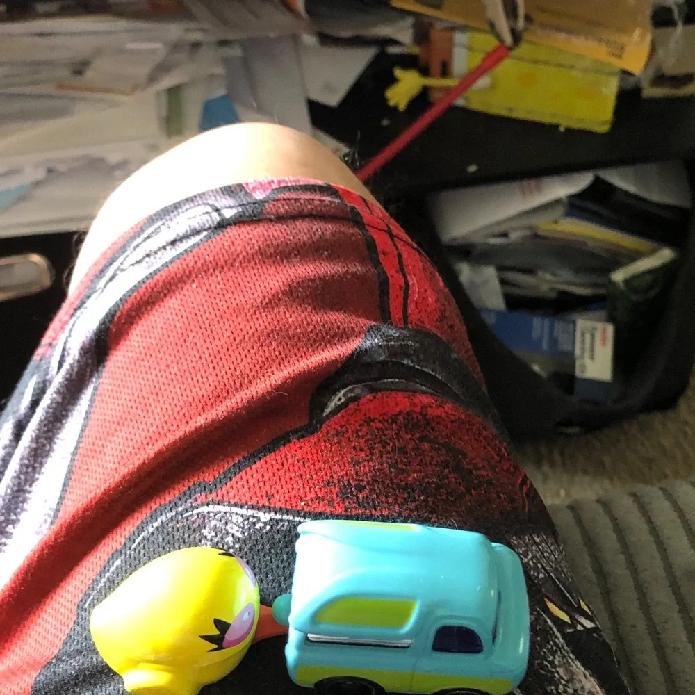 Bright Turquoise Toy Car with Yellow Character